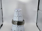 A silver metal link watch band for a Aokulasic Open Heart Automatic shown around a stack of white paper cone size guides printed with inch and centimeter measurements, on a light gray background.