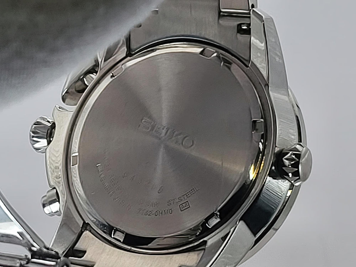 Close-up of the back of a stainless steel Seiko Flightmaster wristwatch showing the brushed metal case back with the Beiko logo engraved in the center.