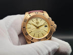 The Midas SJT Original wristwatch with a textured dial and bezel, held in a white-gloved hand against a dark background.