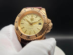 The Midas SJT Original wristwatch with a textured dial, black bezel markings, and a dark brown leather strap, held in a white-gloved hand against a dark background.